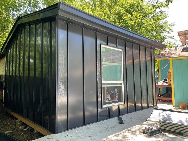 Black standing seam metal wall panels for Roof Inspection in Waupaca