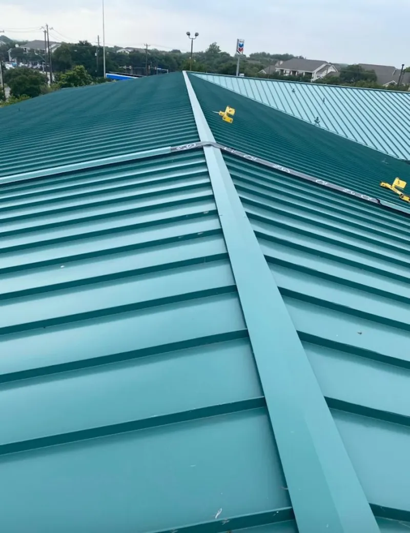 Green commercial metal roof ridge and valley for Metal Roof Repair in Waupaca