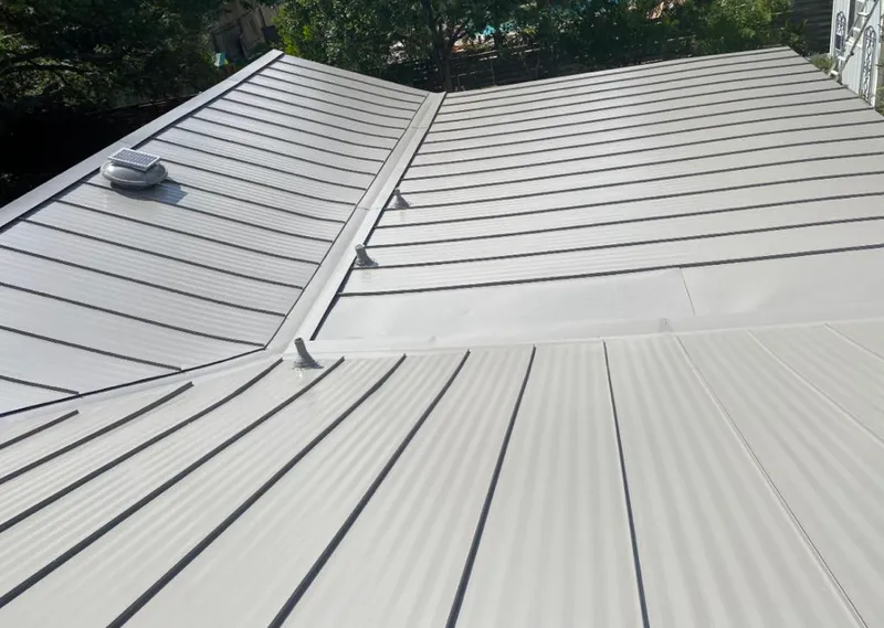 Solar attic fan installed on a metal roof for Roof Ventilation in Waupaca